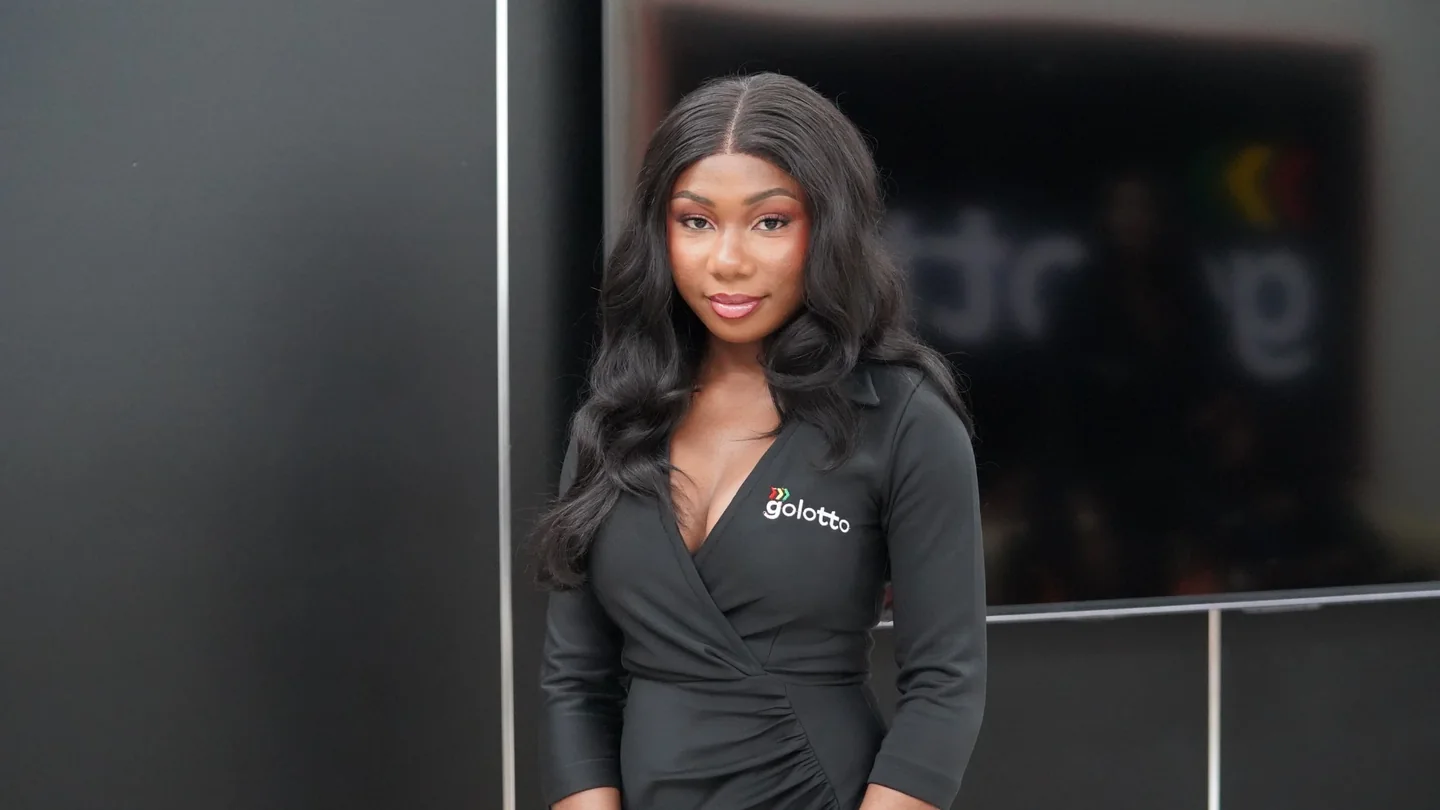 Golotto representative wearing a black outfit with the Golotto logo